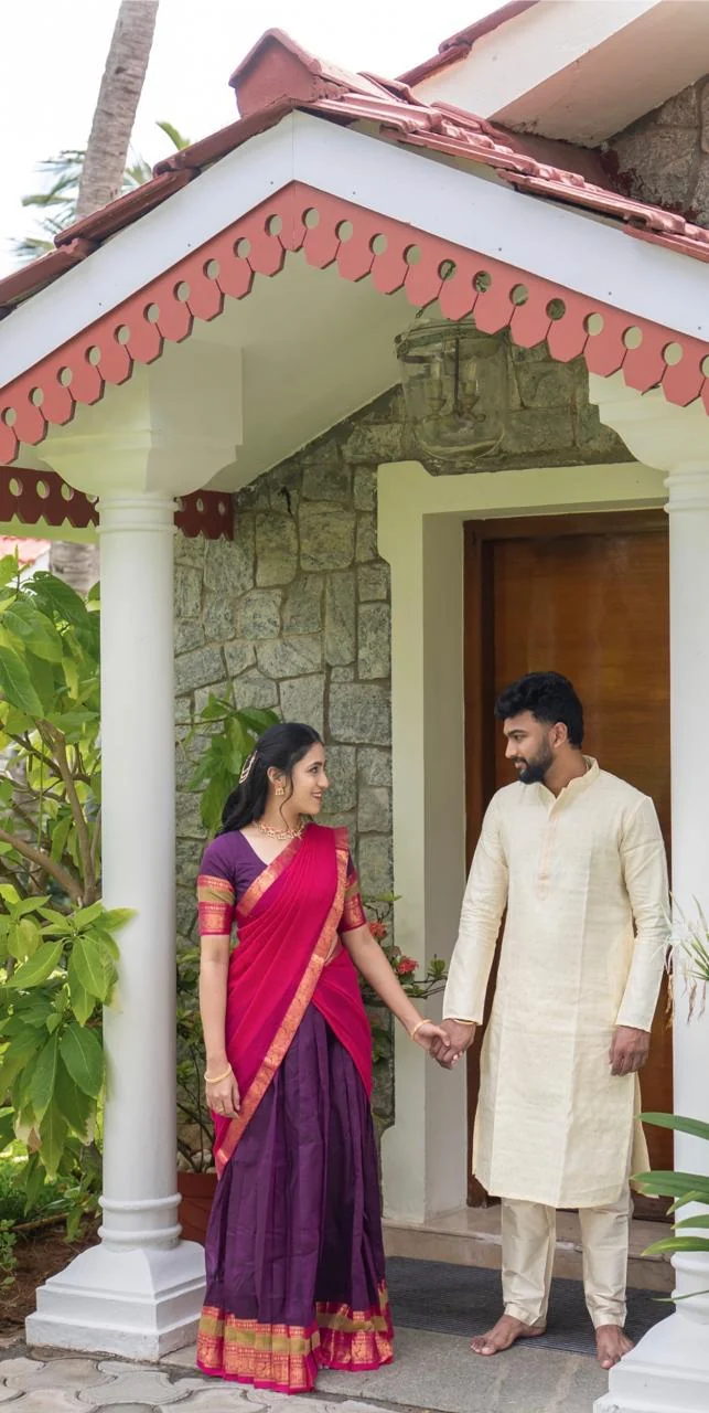 Senthil and Chandra at the doorway